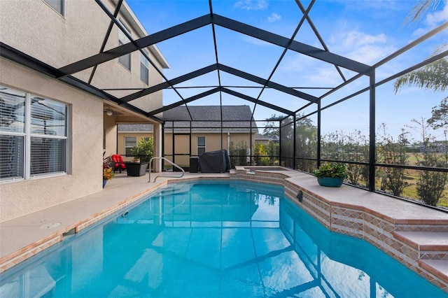 view of pool featuring an in ground hot tub, grilling area, a lanai, and a patio