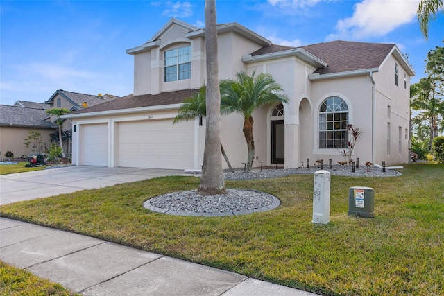 view of front facade with a garage and a front lawn