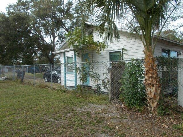 view of property exterior with a lawn