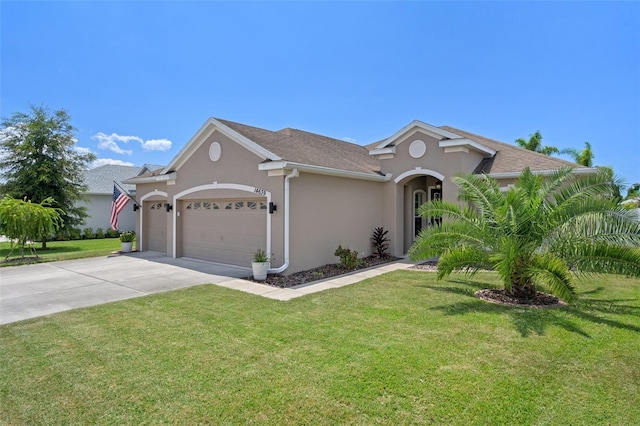 view of front of home featuring a garage and a front lawn