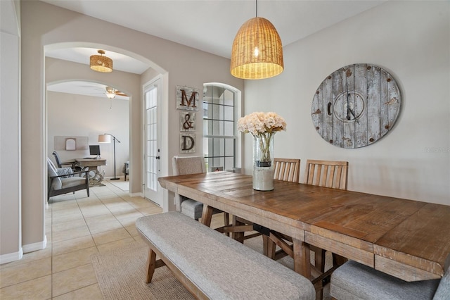 dining room with light tile patterned flooring and ceiling fan