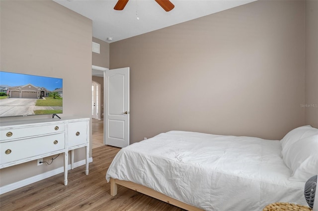 bedroom featuring ceiling fan and light wood-type flooring