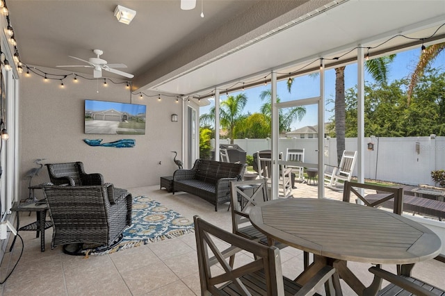 sunroom / solarium with ceiling fan