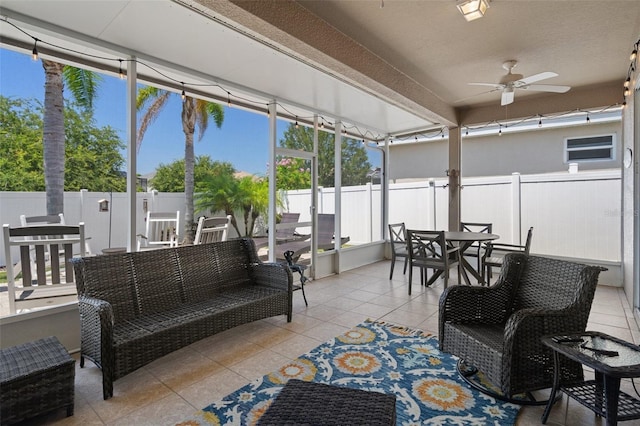 sunroom / solarium with ceiling fan