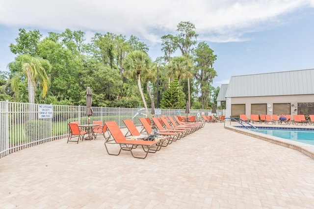 view of swimming pool featuring a patio