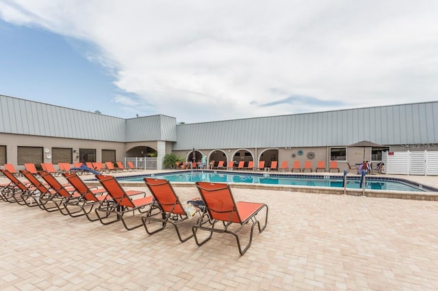 view of pool featuring a patio area