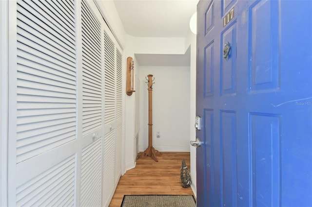 hallway featuring hardwood / wood-style flooring