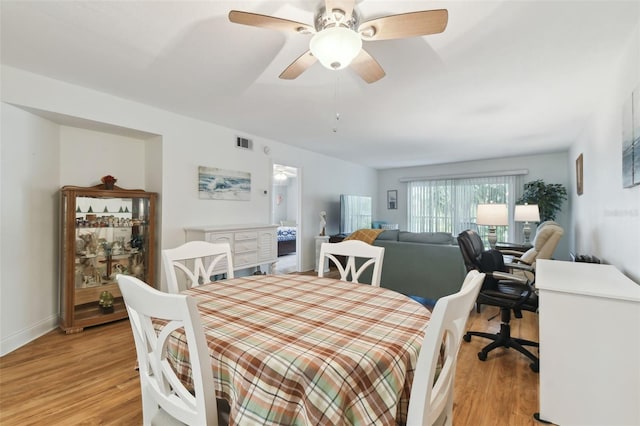 dining room featuring ceiling fan and light hardwood / wood-style flooring