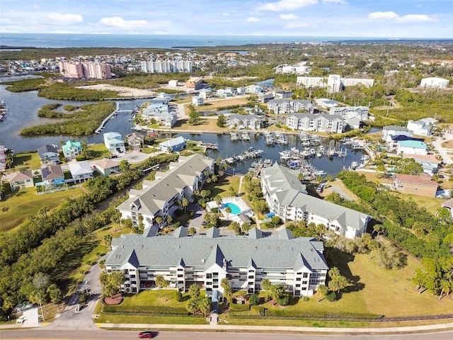 birds eye view of property featuring a water view