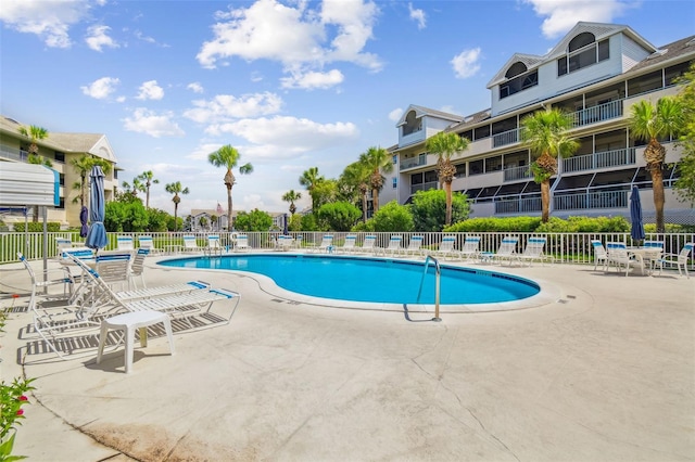 view of swimming pool featuring a patio area