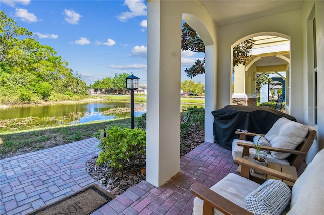 view of patio featuring a water view