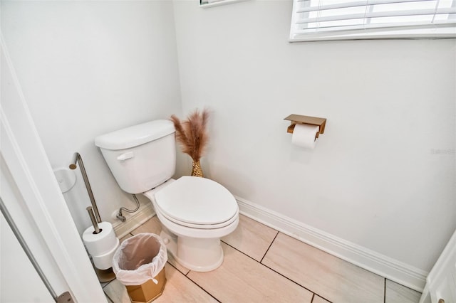 bathroom with toilet and tile patterned flooring