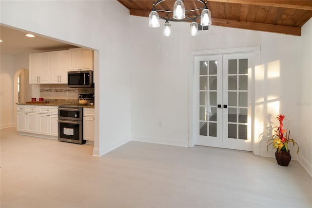 kitchen with french doors, appliances with stainless steel finishes, wooden ceiling, and decorative light fixtures