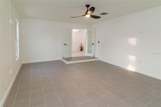 spare room featuring french doors and ceiling fan