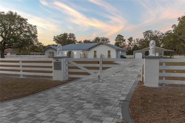 view of gate at dusk