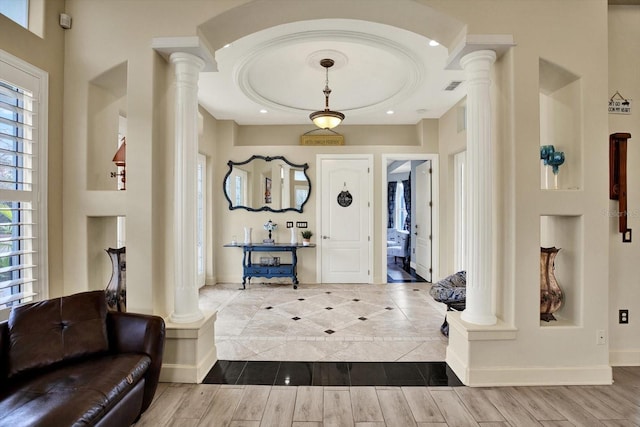 foyer featuring ornate columns