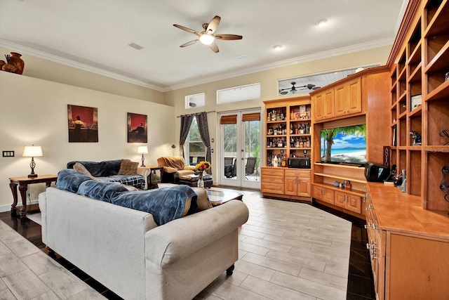 living room with crown molding, ceiling fan, and french doors