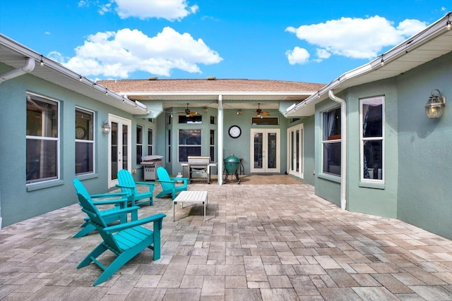 view of patio / terrace with french doors and ceiling fan