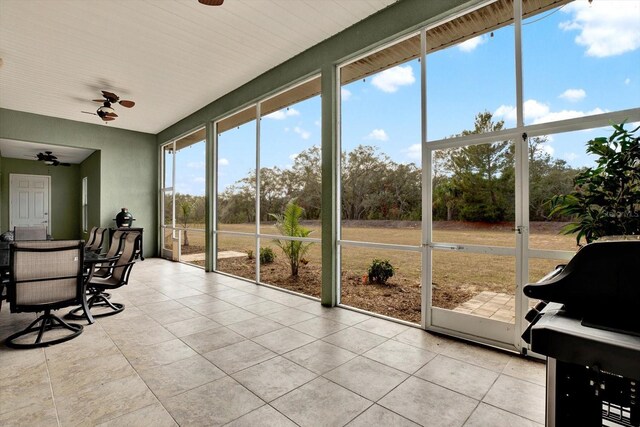 10030 Orchard Way, Spring Hill, FL 34608 - sunroom / solarium with ceiling fan and outdoor dining space