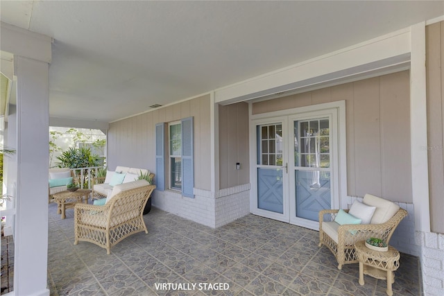 view of patio featuring french doors