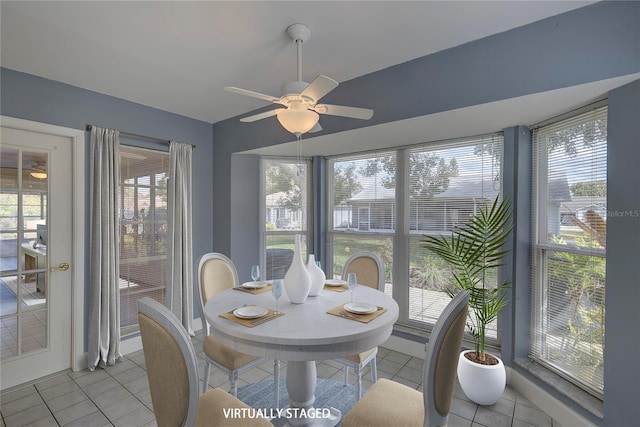 sunroom featuring ceiling fan