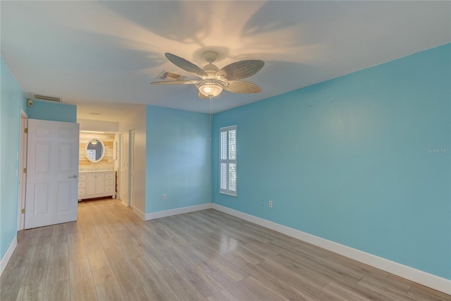 spare room with light hardwood / wood-style floors and ceiling fan