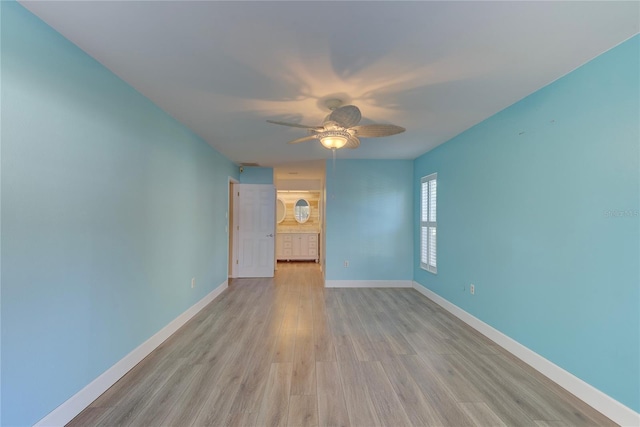 unfurnished room featuring ceiling fan and light hardwood / wood-style floors