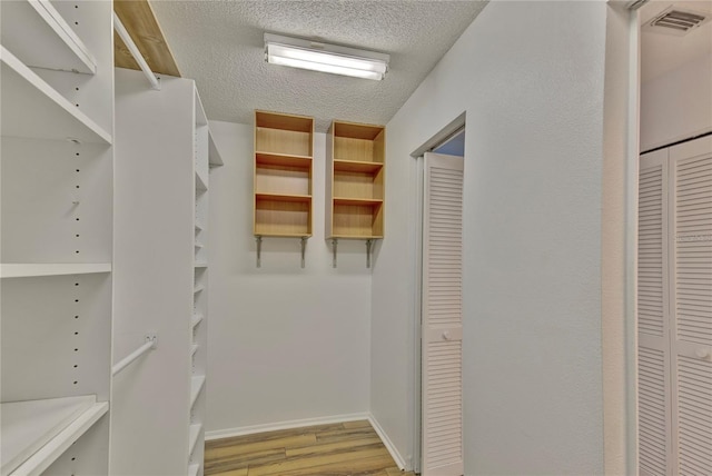 spacious closet with light wood-type flooring