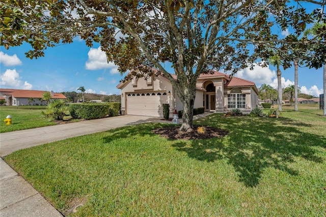 view of front of property with a garage and a front yard