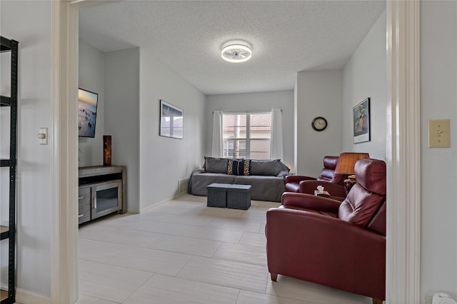 living room with a textured ceiling