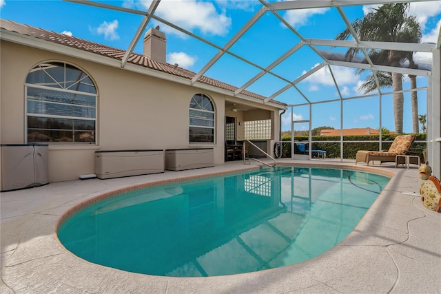 view of pool featuring a patio and a lanai