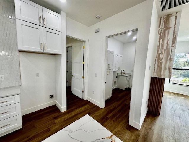 bedroom with dark hardwood / wood-style flooring