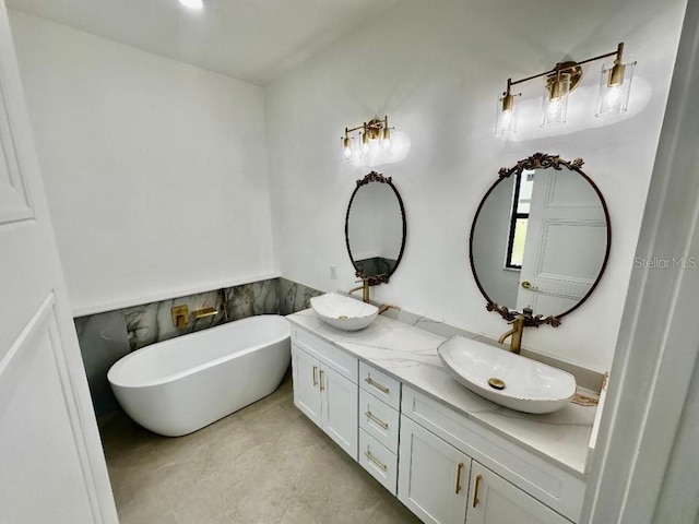 bathroom with vanity and a washtub