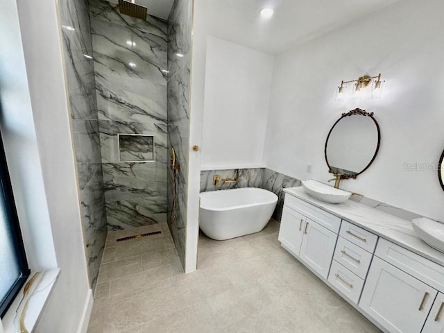 bathroom with plus walk in shower and vanity