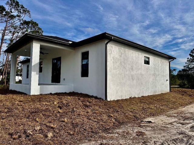 view of home's exterior with ceiling fan