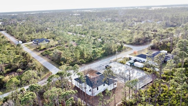 aerial view featuring a view of trees