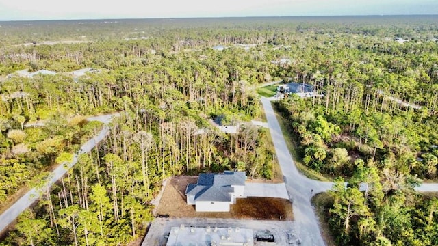 aerial view featuring a forest view