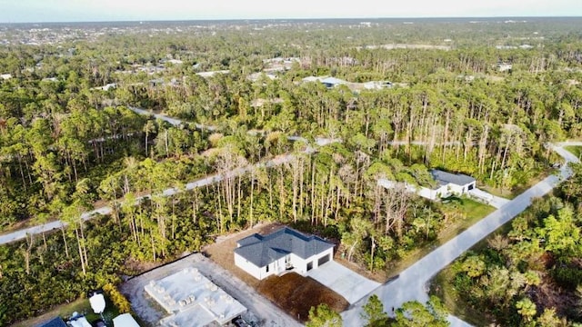 drone / aerial view with a view of trees