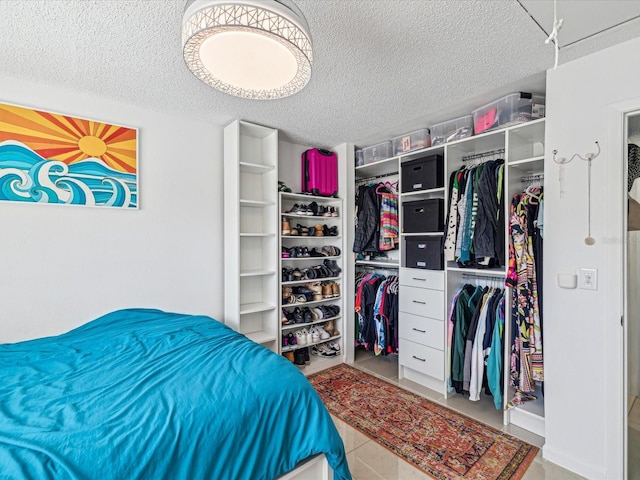 bedroom featuring a textured ceiling and a closet