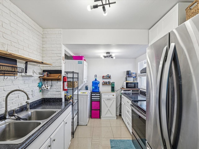 kitchen featuring sink, white cabinets, and appliances with stainless steel finishes