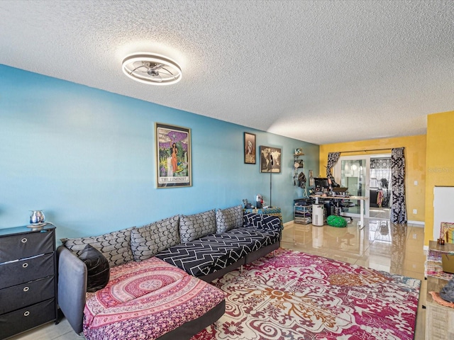 tiled living room featuring a textured ceiling