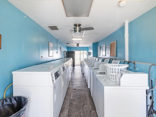 clothes washing area featuring separate washer and dryer, dark wood-type flooring, and ceiling fan