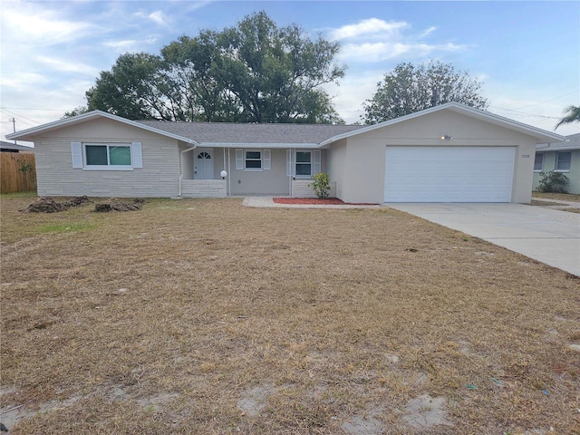 single story home with a garage and a front yard