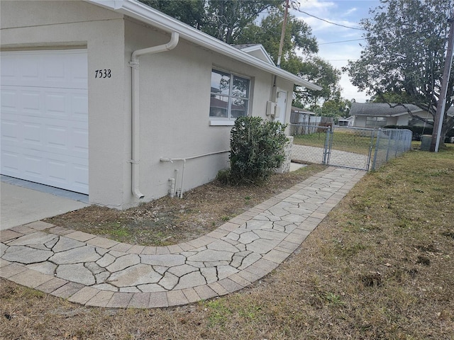 view of side of property featuring a garage