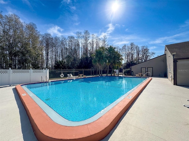 view of swimming pool with a patio