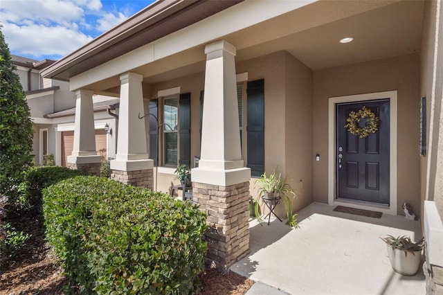 doorway to property with covered porch