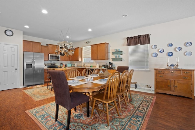 dining space with dark hardwood / wood-style floors