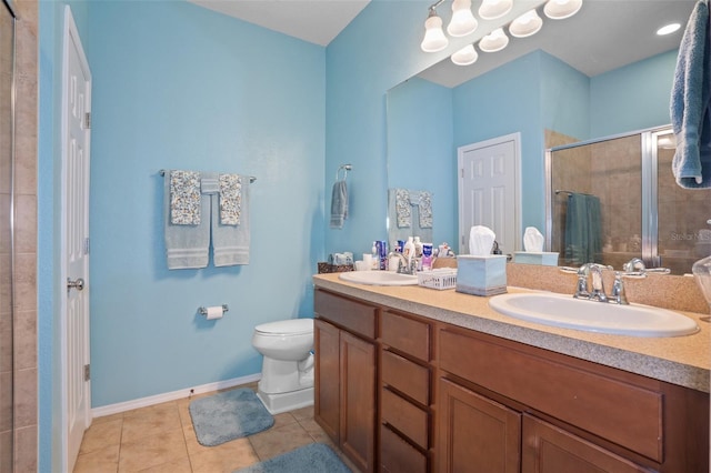 bathroom featuring an enclosed shower, vanity, tile patterned floors, and toilet