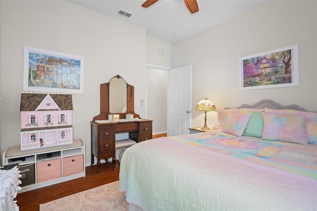 bedroom with hardwood / wood-style floors and ceiling fan