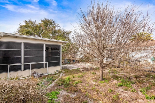 view of yard with a sunroom